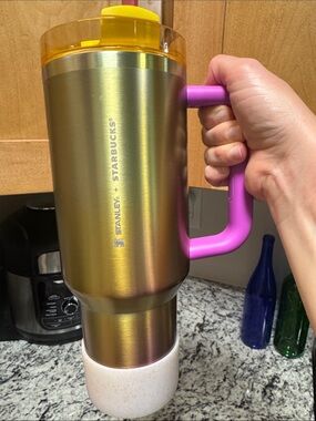 Stanley + Starbucks Iridescent Gold water bottle and bottom cover